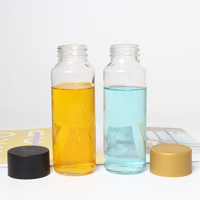 空玻璃果汁饮料瓶带塑料盖